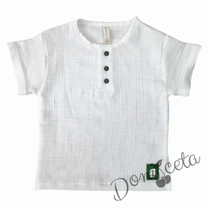 Kids blouse for boy in ecru muslin with short sleeves with green leather element