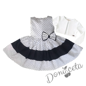 Комплект от детска рокля без ръкав в бяло на черни точки с лента и болеро в екрю 1