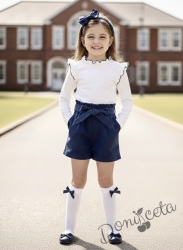 Комплект за момиче от къси панталони в тъмносиньо и блуза в бяло с къдрици с тъмносин кант