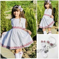 Комплект от детска рокля с дълъг ръкав в бяло с ширит с червени розички и фолклорни етно мотиви, диадема и чорапки