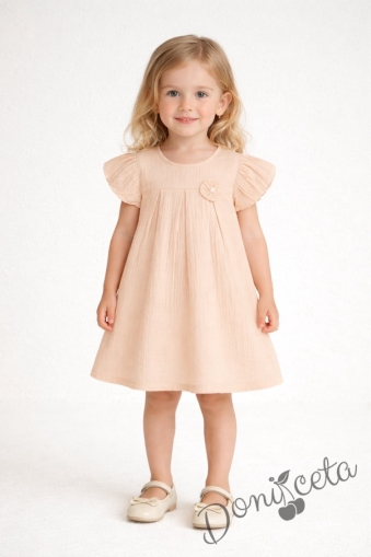 Детска ежедневна рокля с къс ръкав в прасковен цвят от памучен муселин