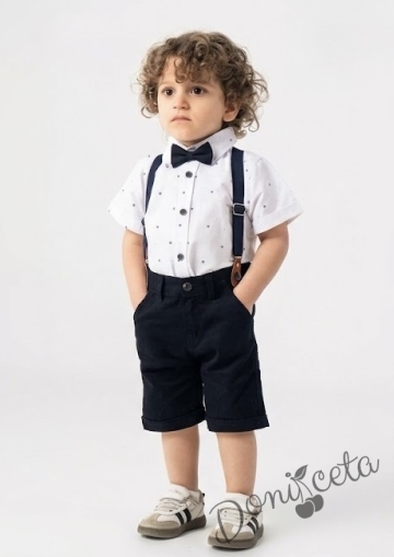 Комплект за момче от 4 части - риза в бял цвят с тъмносини орнаменти с къс ръкав, къси панталони и папийонка в тъмносиньо и тиранти 