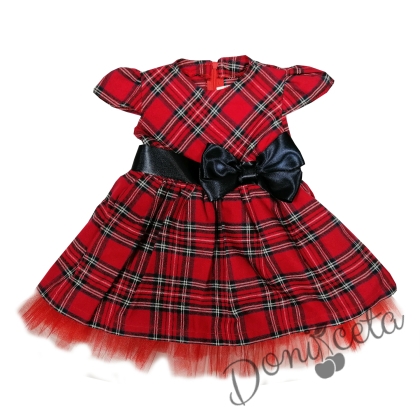 Children's dress in red and blue with a vest in dark blue
