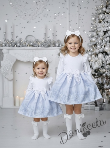 Детска коледна рокля в бяло с къдрички, панделка и зимни къщички 