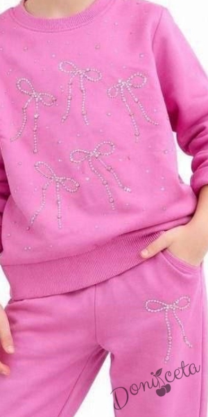 Спортен комплект за момиче от горнище и долнище в розово с панделки