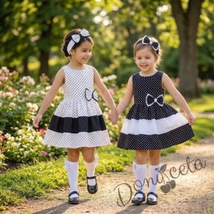 Детска рокля без ръкав в бяло на черни точки с лента в бяло Далента