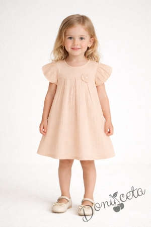 Детска ежедневна рокля с къс ръкав в прасковен цвят от памучен муселин