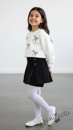 Комплект за момиче от блуза в бяло с панделки и пола панталонки в черно