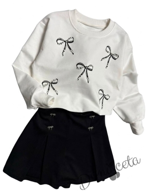 Комплект за момиче от блуза в бяло с панделки и пола панталонки в черно