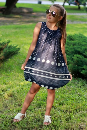 Summer children's dress in dark blue with dots