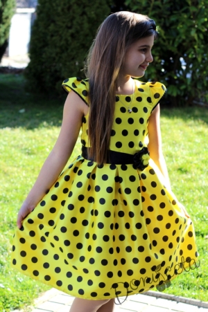 Празнична детска рокля в жълто на черно точки