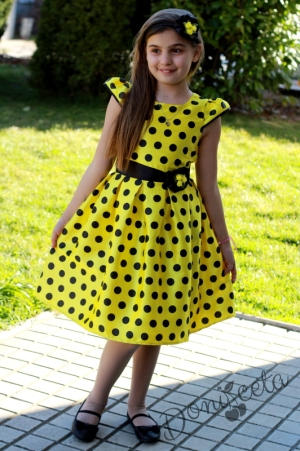 Празнична детска рокля в жълто на черно точки
