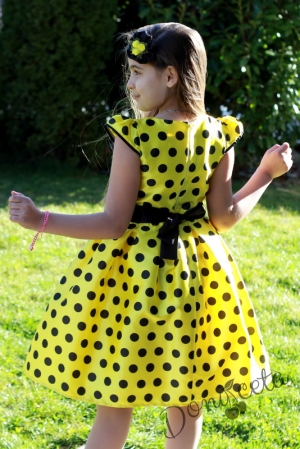 Празнична детска рокля в жълто на черно точки