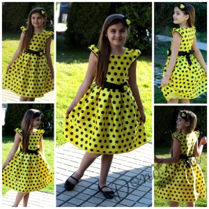 Празнична детска роля в жълто на черно точки.