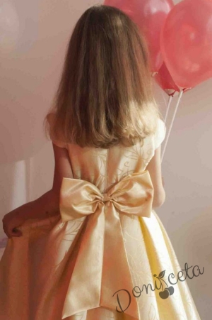 Официална детска рокля в златисто с шлейф с голяма панделка отзад