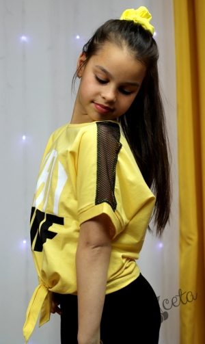 Летен детски комплект от къса тениска в жълто и клин в черно 8224388