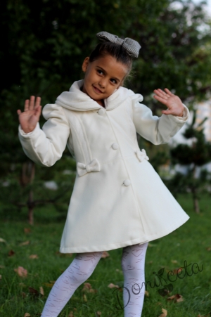 Children's winter coat for a girl in ecru with lace and ribbons