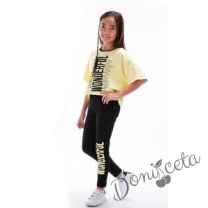 Комплект за момиче от тениска в жълто с надпис и клин в черно 9431133