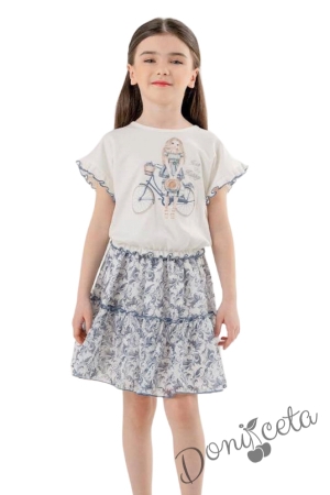 Детски комплект от блуза с къс ръкав в екрю с момиче и колело и шарена пола с харбала в синьо 1