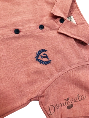 Set of children's short sleeve shirt with emblem in peach and short jeans in blue.